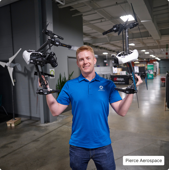 PIERCE AEROSPACE – MAN HOLDING DRONES